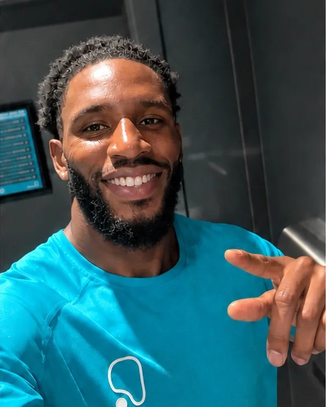 Nathaniel Wynter, smiling, in the gym